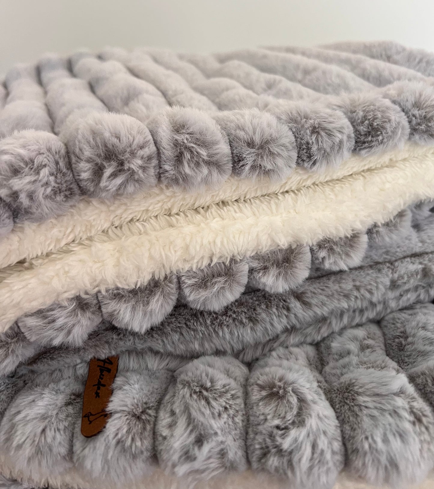 Snuggle sacks in Snow Leopard with soft cosy lining in cream
