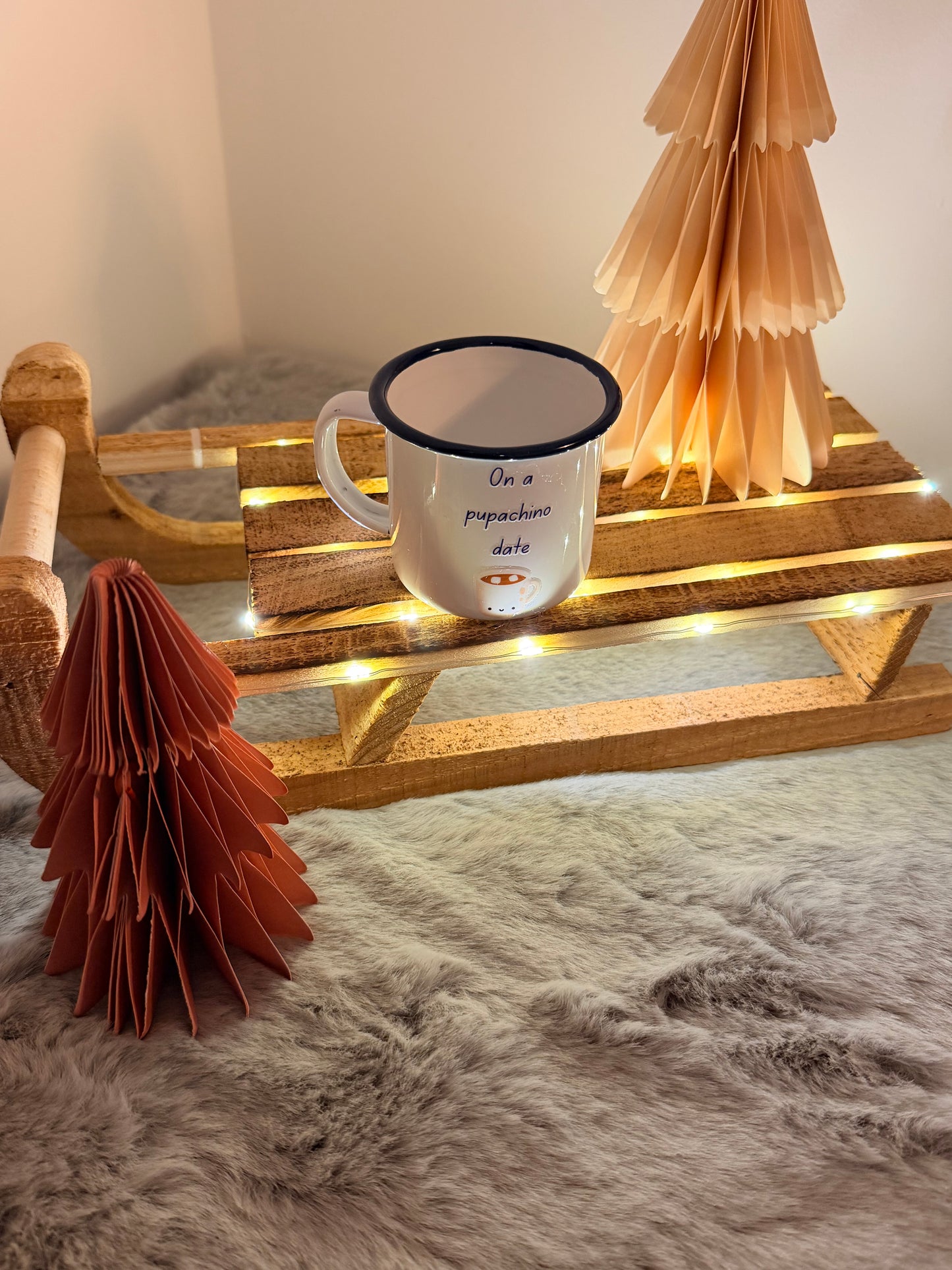 Mug with text on a wooden stand with decorative elements