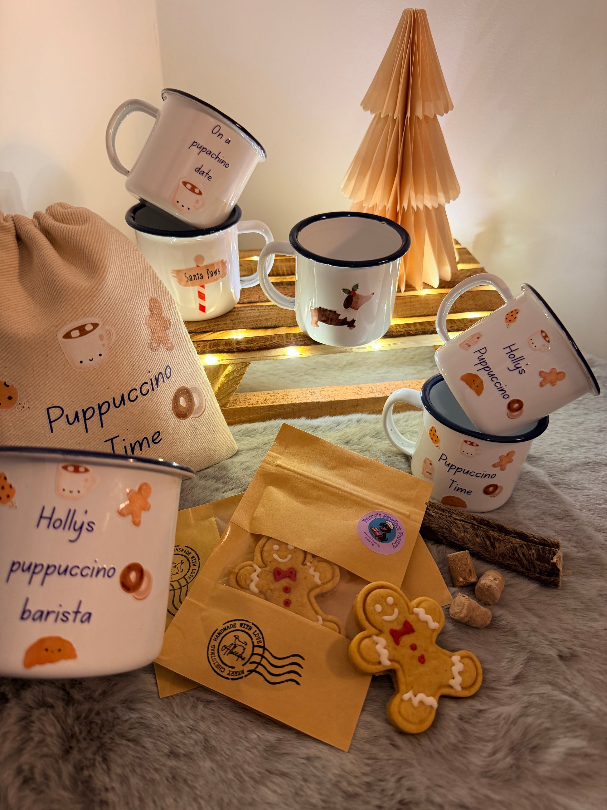 Set of mugs with cartoon designs on a textured surface