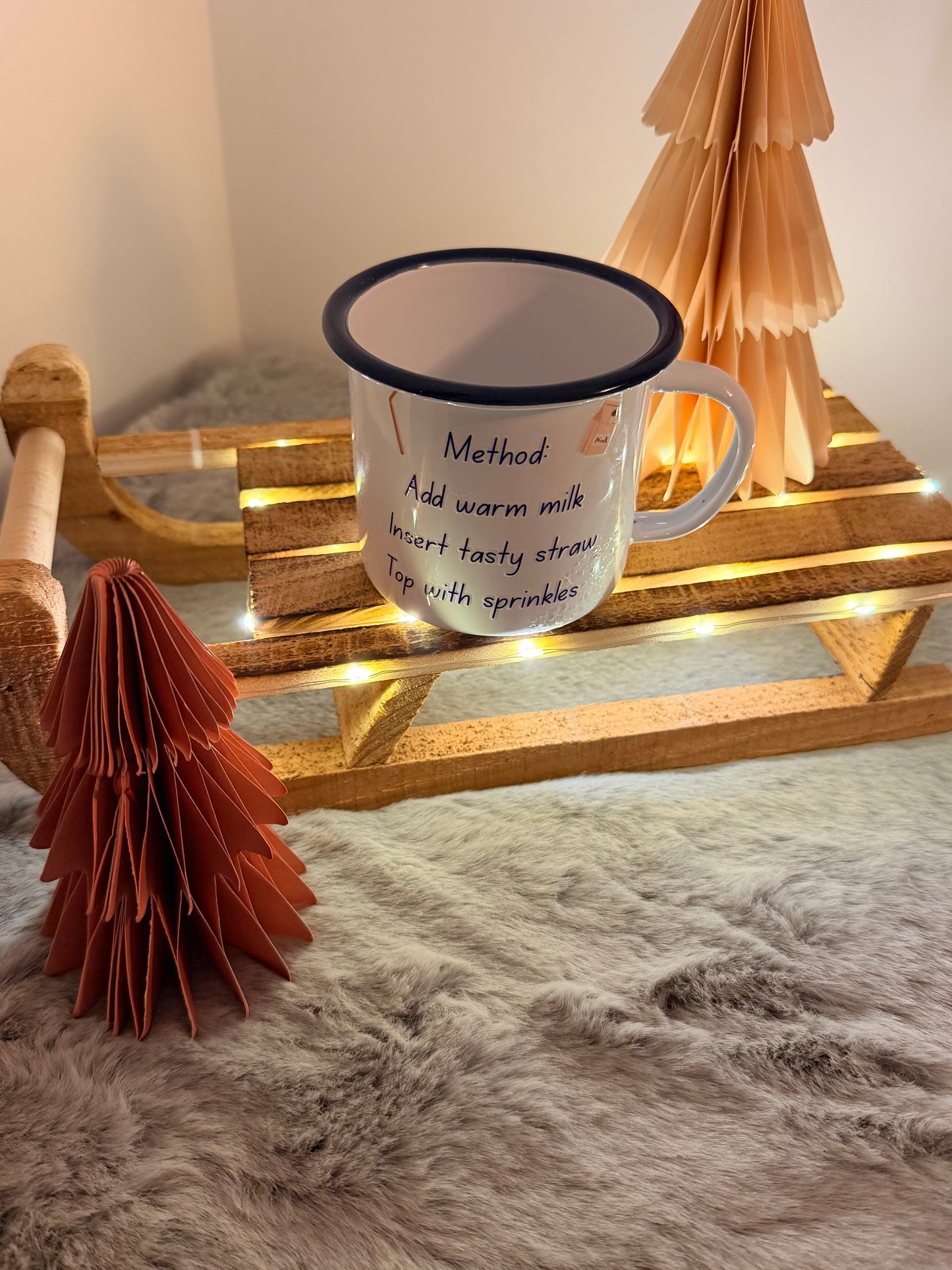 Mug with text on a wooden stand with decorative elements