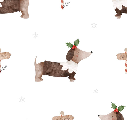 Pattern of dachshunds with Christmas pudding dressed sausage dogs decorations on a white background