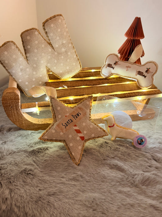 Decorative wall art with stars and bones on a textured surface